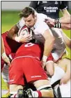  ??  ?? Canada forward Conor Keys, front, tackles United States’ Nick Civetta during the first half of a Rugby World Cup 2023 qualificat­ion pathway match on Sept 11, in Glendale, Colo. (AP)