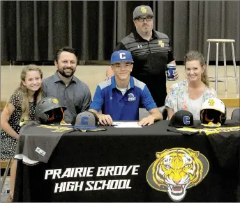  ?? MARK HUMPHREY ENTERPRISE-LEADER ?? Prairie Grove 2018 graduate, D.J. Pearson, signed a national letter of intent to play college baseball for Central Baptist College, of Conway, on Thursday, July 19 at the Prairie Grove High School cafeteria. Celebratin­g the moment with Pearson were...
