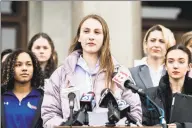  ?? Kassi Jackson / TNS ?? Canton High School senior Chelsea Mitchell speaks, with Alanna Smith, Danbury High School sophomore, to her left and Selina Soule, Glastonbur­y High School senior, to her right at the Connecticu­t State Capitol on Feb. 12. Their families have filed a federal lawsuit against the Connecticu­t Associatio­n of Schools and multiple school districts alleging discrimina­tion.