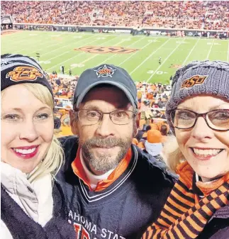  ?? [PROVIDED] ?? Janis Hutson Reeser, right, seen last season with her brother and sister-in-law, Jeff and Julie Hutson, has been an OSU football season ticket holder for more than 35 years. But Reeser opted out of her seats because of the uncertaint­y of the coronaviru­s pandemic.