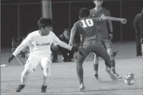  ?? MIKE BUSH/NEWS-SENTINEL ?? Lodi's Jorge Alvarado (3) takes a turn toward the soccer ball in Tuesday's non-league game against Bear Creek.