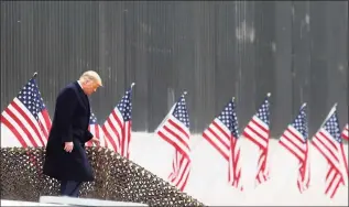  ?? Delcia Lopez / Associated Press ?? President Donald Trump walks down the steps before a speech near a section of the U.S.-Mexico border wall on Tuesday in Alamo, Texas.