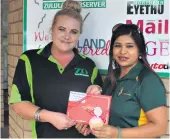  ??  ?? Mandy Govender (right) won a high tea outing at The Oyster Box, courtesy of Ritchie Ford. Sales consultant Daleen Swart presented her prize