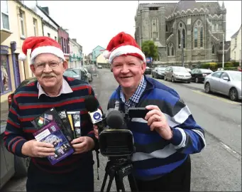  ??  ?? Presenter John O Sullivan with Christy Riordan Director and Cameraman CR Videos Cahersivee­n, with some of their DVDs for sale this Christmas.