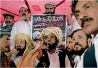  ?? Reuters ?? Mohammed Khan Mehsud, the father of slain Naqibullah Mehsud, speaks to the grand jirga in Karachi. —