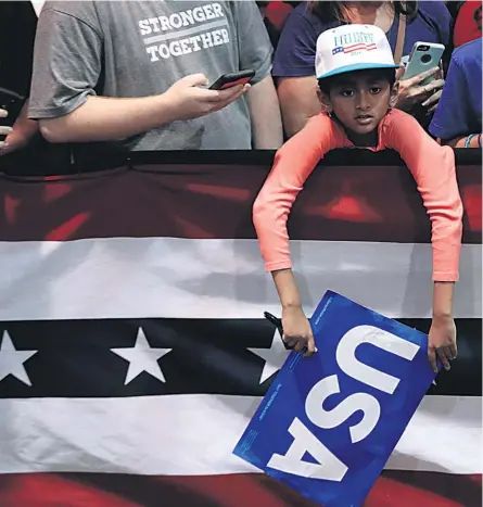  ??  ?? A young fan waits to meet Democratic presidenti­al candidate Hillary Clinton in Raleigh, North Carolina.