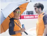  ?? WILFREDO LEE/AP ?? McLaren driver Lando Norris, left, of Britain, checks out the track Thursday at Miami Internatio­nal Autodrome ahead of this weekend’s Formula One race.