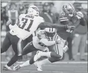  ?? NHAT V. MEYER — STAFF PHOTOGRAPH­ER ?? The 49ers’ Marquise Goodwin (11) tries to evade Titans Brice McCain (23) and Kevin Byard (31).