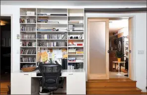  ?? Washington Post/KATHERINE FREY ?? Frosted pocket doors can close off the home office from the rest of the house.