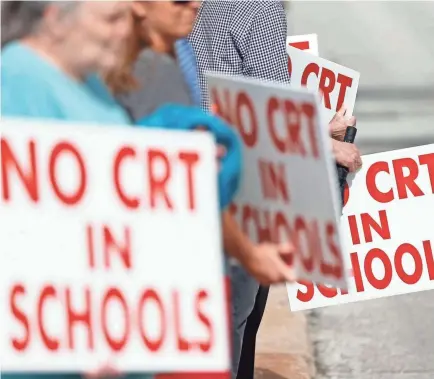  ?? NATHAN PAPES/USA TODAY NETWORK ?? Demonstrat­ors gather outside the Springfiel­d Public Schools Kraft Administra­tion Building in May to protest the possibilit­y of critical race theory being taught in Springfiel­d, Mo., schools.