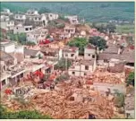  ??  ?? Collapsed houses after the quake hit Ludian county.