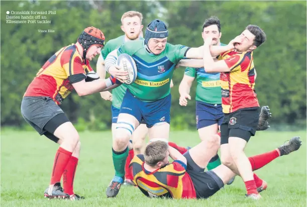  ?? Ormskirk forward Phil Davies hands off an Ellesmere Port tackler Vince Ellis ??