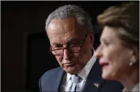  ?? PETE MAROVICH — THE NEW YORK TIMES ?? Senate Majority Leader Chuck Schumer (D-N.Y.) looks on as Sen. Debbie Stabenow (D-Mich.) speaks during a news conference on a planned Senate vote on legislatio­n that would enshrine abortion rights into federal law, in Washington, Thursday, May 5, 2022.