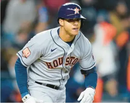  ?? JOHN MINCHILLO/AP ?? Astros shortstop Jeremy Pena tosses his bat after hitting a three-run home run against the Yankees during the ALCS on Oct. 23 in New York.