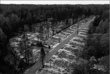  ?? AP Photo/Noah Berger ?? In this 2018 file photo, charred footprints of homes leveled by the Camp Fire line the streets at the Ridgewood Mobile Home Park retirement community in Paradise, Calif.