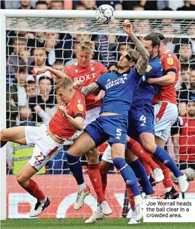  ??  ?? Joe Worrall heads the ball clear in a crowded area.