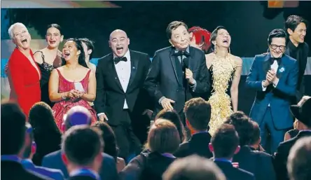  ?? JAMES HONG Robert Gauthier Los Angeles Times ?? gives a compelling speech as the joyful cast of “Everything Everywhere All at Once” accepts a SAG Award on Sunday.