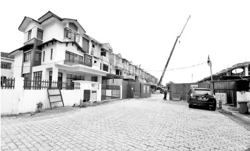  ??  ?? Fourty-four units of double-storey houses built in Kampung Padang Balang under Malay Land Reserve. - Bernama photo