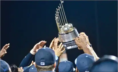  ?? KYLE FRANKO — TRENTONIAN PHOTO ?? In this 2019 file photo, Thunder players celebrate with the Eastern League trophy after beating Bowie in Game 4 of the ELCS. Double-A baseball is no more in Trenton after the Yankees divorced themselves from the Thunder and moved to Somerset.