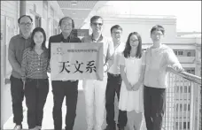  ?? PHOTOS BY XINHUA ?? Italian scholar Denis Bastieri (left) visits a photograph­y exhibition at Guangzhou Library on Saturday. Bastieri (center) with colleagues and students of the astronomy department at Guangzhou University.