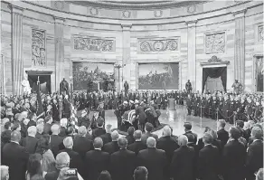  ?? JACK GRUBER/USA TODAY ?? Former President George H.W. Bush lies in state at the U.S. Capitol Rotunda.