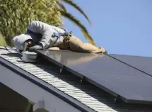  ?? ?? Solar panels are installed on a home in San Jose, Calif., in October. Some people and businesses seeking to use solar panels, batteries and electric vehicles find they can’t because utility equipment needs an upgrade.