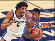  ?? Frank Franklin II / Associated Press ?? UConn’s Isaiah Whaley (5) defends against DePaul’s Kobe Elvis during the first half in March.