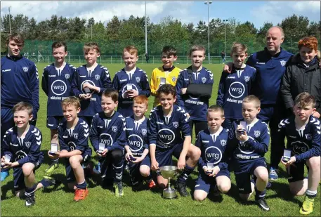  ?? PIctures: Ken Finegan ?? Ardee Celtic celebrate after getting their hands on the Under-12 Dundalk FC Cup at Bellew Park on Sunday afternoon.