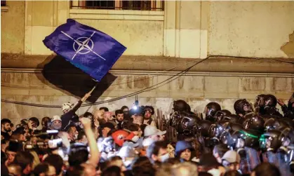  ?? April. Photograph: David Mdzinarish­vili/EPA ?? Georgian riot police block opposition party supporters during a protest against the foreign agents draft bill near the Georgian parliament in Tbilisi, Georgia on 16