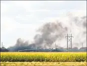  ?? MELANIE STANDIFORD MIDWEST MEDIA VIA AP ?? Smoke rises after an explosion at Union Pacific’s Bailey Yard in North Platte, Neb., on Thursday.