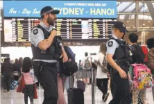  ?? William West / AFP / Getty Images ?? The discovery of the plot led authoritie­s to tighten airport security around Sydney and across the nation last weekend.