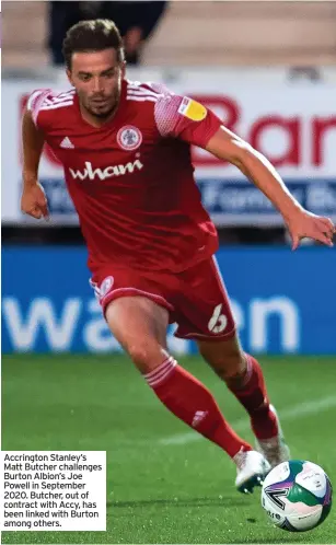  ?? ?? Accrington Stanley’s Matt Butcher challenges Burton Albion’s Joe Powell in September 2020. Butcher, out of contract with Accy, has been linked with Burton among others.