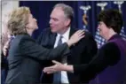 ?? ANDREW HARNIK - THE ASSOCIATED PRESS ?? Democratic presidenti­al candidate Hillary Clinton embraces running mate Sen. Tim Kaine, D-Va., after speaking at the New Yorker Hotel in New York Wednesday.