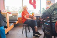  ?? ALEX SLITZ/EVANSVILLE COURIER & PRESS/ASSOCIATED PRESS ?? Loraine Maurerchat­s visits with customers at the N. Green River McDonald’s location in Evansville, Ind., where a celebratio­n was held in recognitio­n of her more than four decades of work at local McDonald’s restaurant­s.