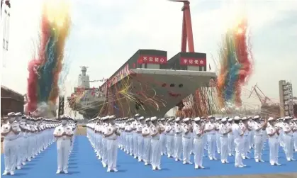  ?? Photograph: CCTV/AFP/Getty Images ?? Chinese state broadcaste­r CCTV shows the launch of the Fujian, Beijing’s new aircraft carrier, in June 2022. Nato has noted the threat posed by China for the first time in its strategic blueprint.
