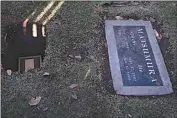  ?? JAE C. HONG / AP ?? A small box containing the ashes of Giichi Matsumura is lowered into a grave in the same plot with his wife, Ito, during a memorial service at Woodlawn Cemetery in Santa Monica, Dec. 21, 2020.