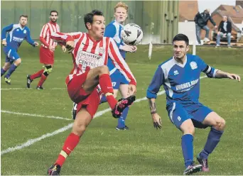  ??  ?? Myers (red and white) battle in vain against Herrington CW last week. Pictures by Kevin Brady.