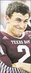  ?? PHOTO BY GETTY ?? Johnny Manziel can grin all the way to the bank now that he forgoes his final two years at Texas A&M and declares for NFL draft.