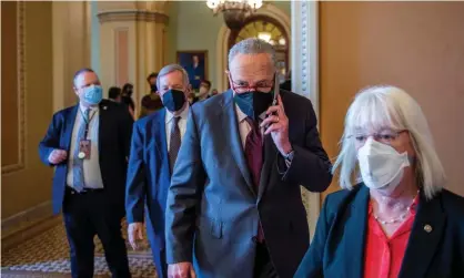  ?? Photograph: REX/Shuttersto­ck ?? Senate majority leader Chuck Schumer, center, outlined a maneuver that would open debate on voting rights legislatio­n.