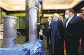  ?? IRANIAN PRESIDENCY OFFICE VIA AP ?? Iran’s President Hassan Rouhani (second right) observes Iran’s new nuclear achievemen­ts Saturday.