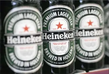  ?? PHOTO: BLOOMBERG ?? Heineken, the Dutch brewer of Europe’s top selling lager, expects beer sales in Africa, Latin America and Asia to drive a return to revenue growth this year after a slowdown in emerging markets led to flat turnover last year. It predicts volume growth and cost cuts will help improve its margin.