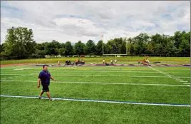  ?? Paul Buckowski / Times Union ?? Bobby Burns surveys his new team’s field the day before practice was set to begin. He said it wasn’t an easy decision to leave Troy.