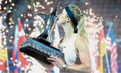  ??  ?? It’s mine again: Elina Svitolina of Ukraine kissing the trophy after defeating Daria Kasatkina of Russia in the final of the Dubai Championsh­ips on Saturday. — Reuters
