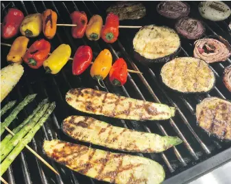 ??  ?? Asparagus, bell peppers, eggplant, onions and zucchini are favourites on the grill.