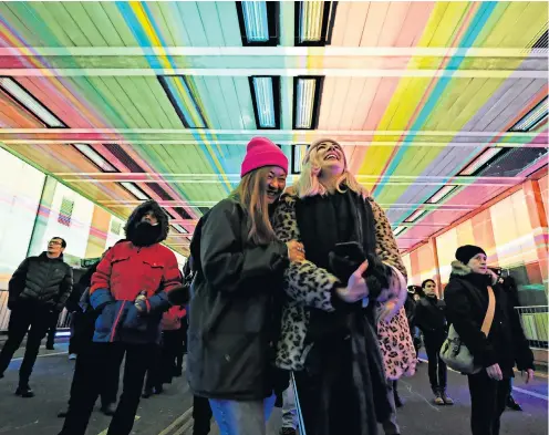  ??  ?? One of the City of London’s busiest streets has been closed to traffic and transforme­d into a free light and sound installati­on for the weekend – creating ‘a journey through music’. Array uses digital projection­s to form what organisers say is a...
