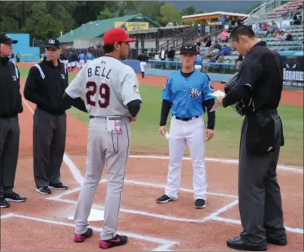  ?? PHOTO VIA @VALLEYCATS ON TWITTER ?? Jason Bell meeting with umpires and Hudson Valley Renegades Manager Blake Butera prior to game two of the NY-Penn League Championsh­ip on Sunday, September 9.
