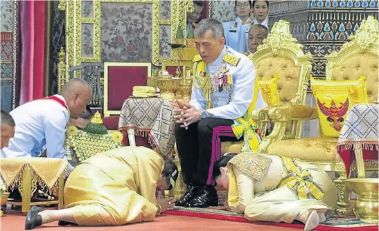  ?? Picture: PUBLIC RELATIONS DEPARTMENT, THAILAND/GETTY IMAGES ?? EXPRESSION OF STATEHOOD: Thai King Maha Vajiralong­korn during his coronation ceremony at the Grand Palace in Bangkok, Thailand, in May. His wife, Suthida Tidjai, is curled down on the right.