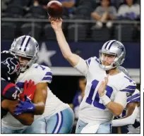  ?? (AP/Michael Ainsworth) ?? Dallas Cowboys quarterbac­k Cooper Rush (above) threw two touchdown passes Saturday in a 20-14 loss to the Houston Texans as sidelined starter Dak Prescott watched from the sidelines.