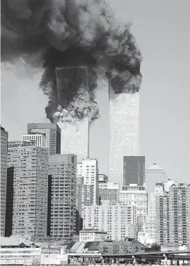  ?? JIM COLLINS/AP ?? The south tower begins to collapse Sept. 11, 2001, as smoke billows from both towers of the World Trade Center in New York. Millions watched it happen on television.