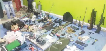  ??  ?? KUWAIT: A large cache of weapons and explosives are seen after a raid on an Andalus house yesterday.